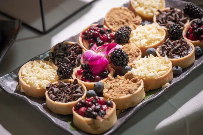 tarts with various toppings on platter