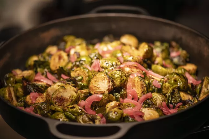 roasted brussels sprouts with pickled onions in skillet