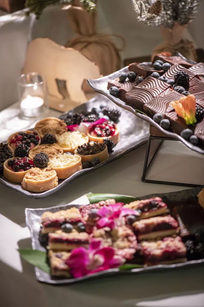 display of various tarts and dessert bars